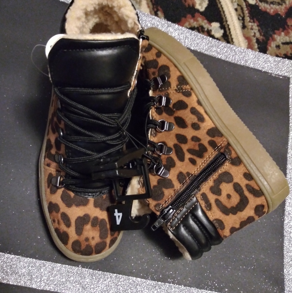 Animal print fur lined boot tie zip enclosure.